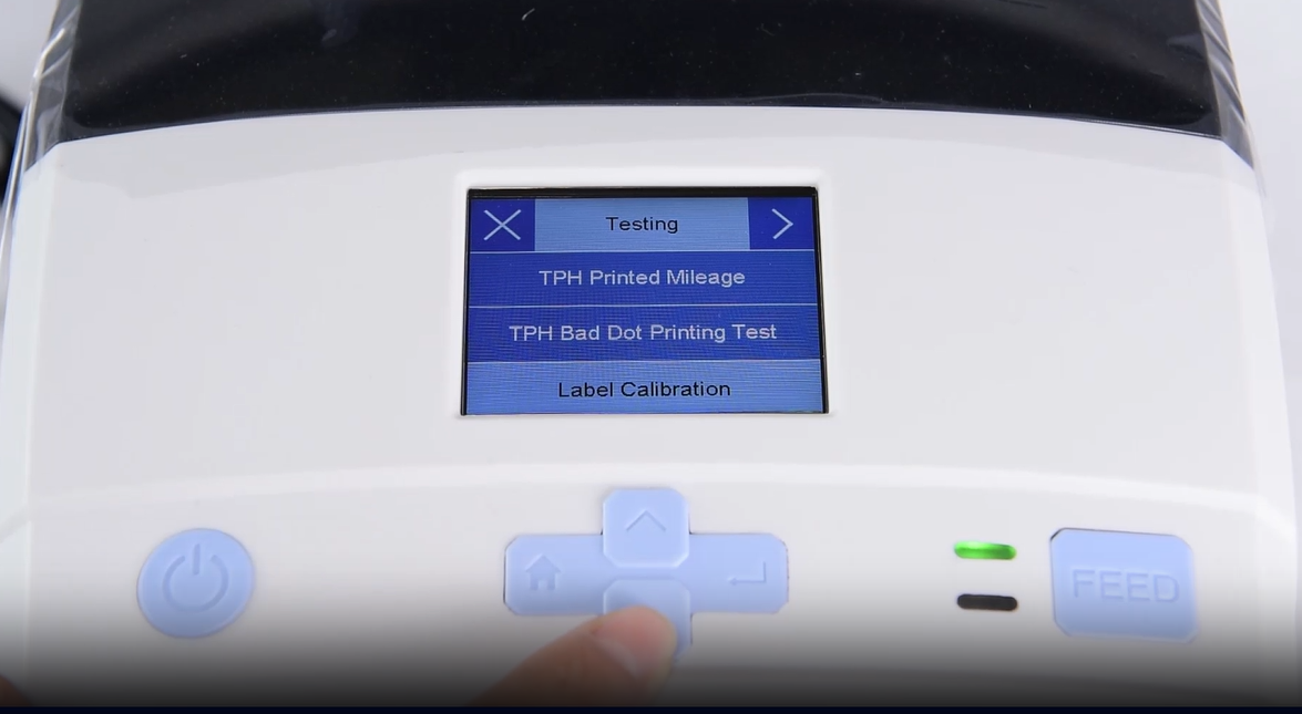 เอ close-up of a machine's digital interface showing a testing menu.